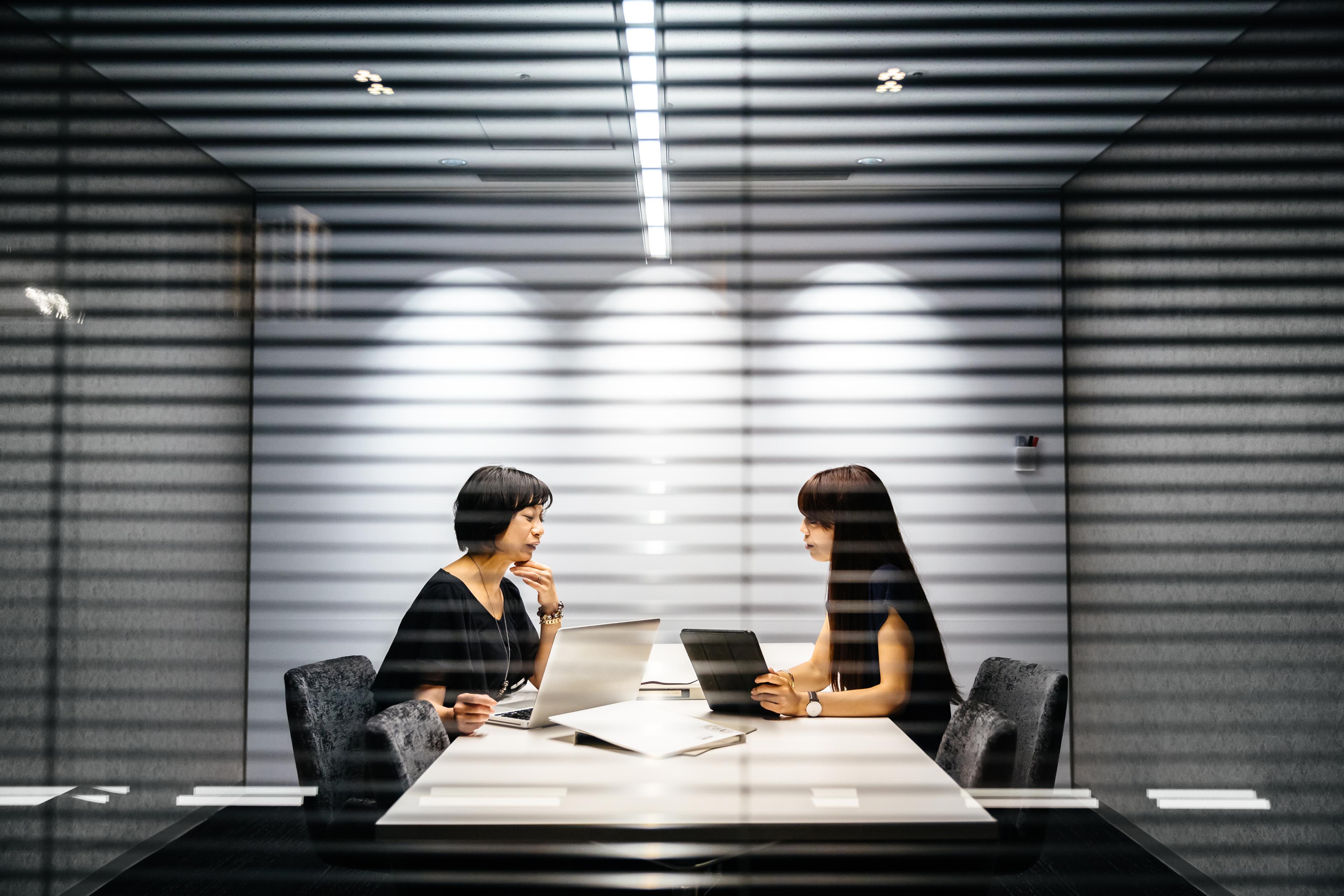 Colleagues in a private coaching meeting