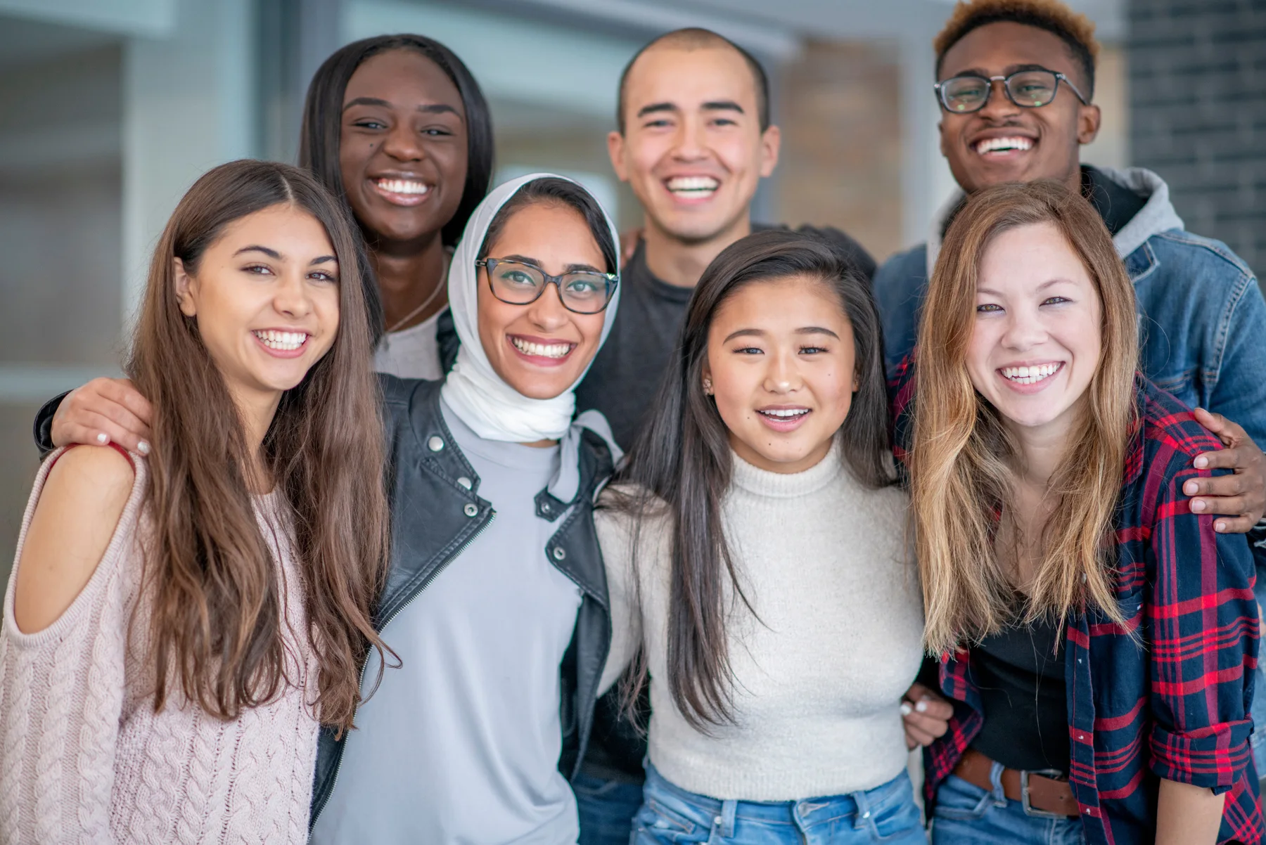 A diverse group of smiling coaching learners